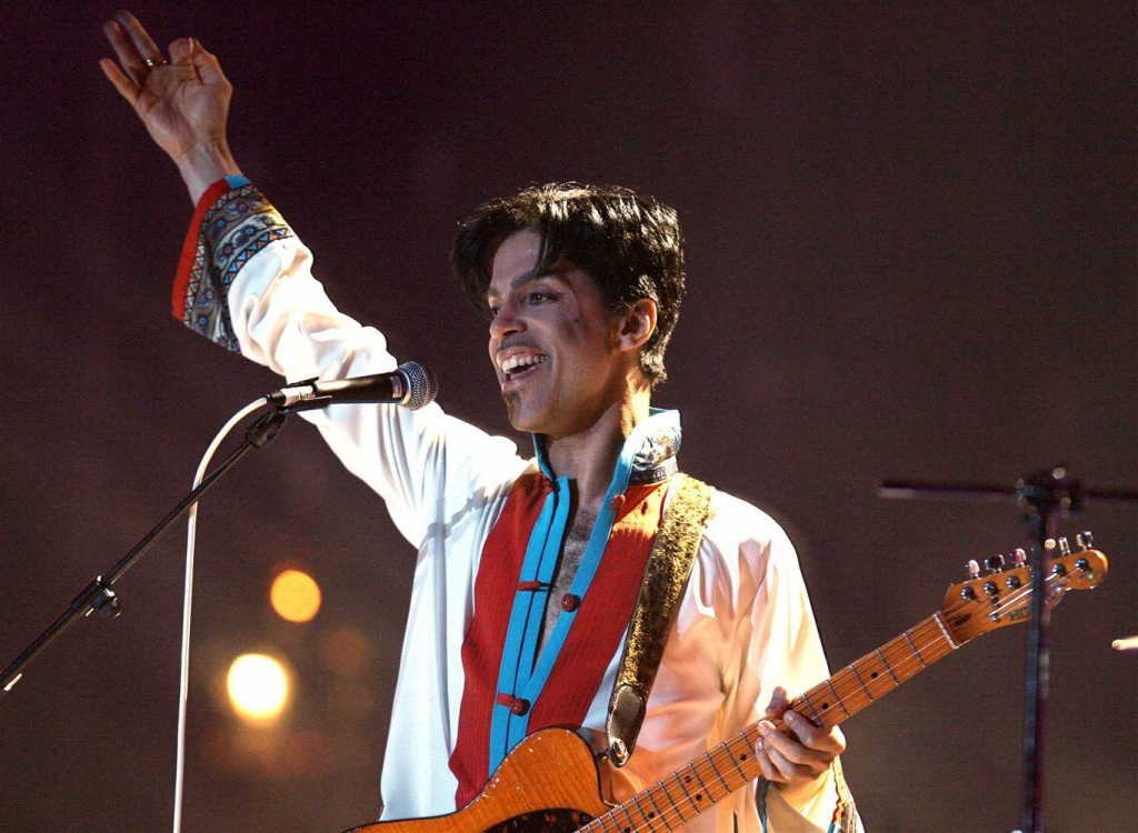 US performs on stage at the Brit Awards at the Earls Court Arena in central London