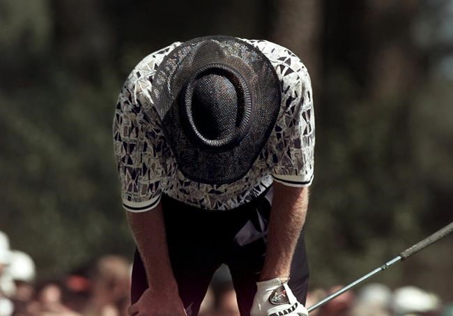 Australia's Greg Norman reacts to a bad tee shot on the fourth hole during final round play of the 1996 Masters golf tournament at the Augusta National Golf Club in Augusta Ga. If the Masters doesn't rea