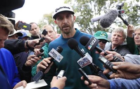 Tannen Maury  EPA		Dustin Johnson spoke with reporters about his decision to withdraw Thursday