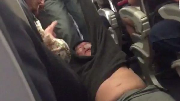 Screenshot of United Airlines passenger David Dao being removed from a plane by force after the airline overbooked the flight. Screenshot Jayce David  Twitter