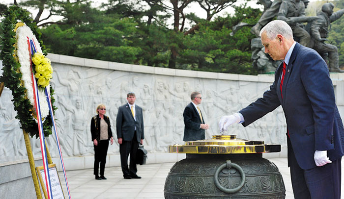 U.S. Vice President Mike Pence pays tribute at the National Cemetery in Seoul on Sunday