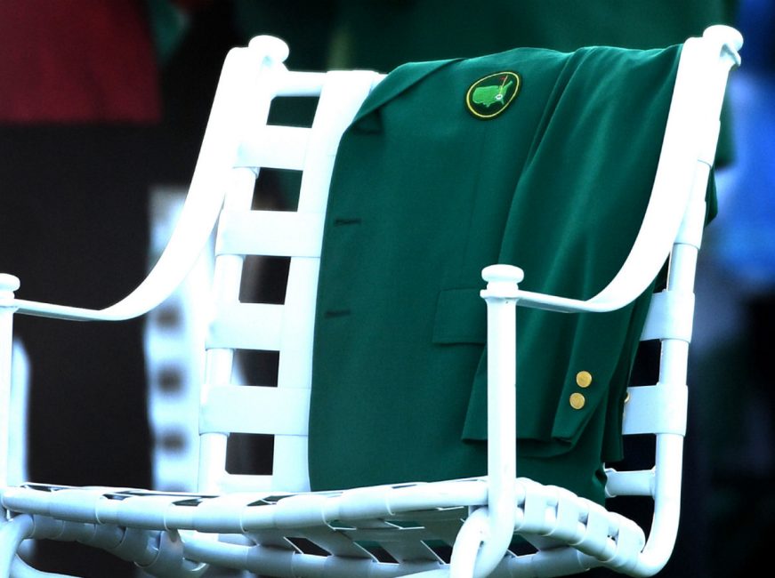 One of Arnold Palmer's green jackets is displayed at the first tee box during the ceremonial opening tee shot ceremony at The Masters tournament on Thursday