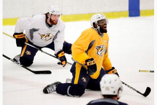 Nashville Predators defenseman P.K. Subban right jokes with teammates during practice at their NHL hockey facility Thursday