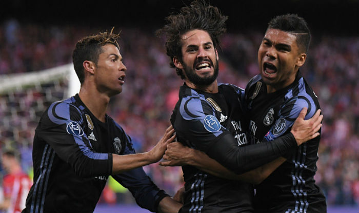 Isco celebrates scoring his team's opening goal with Cristiano Ronaldo and Casemiro during Atletico Madrid vs Real Madrid | Getty Images