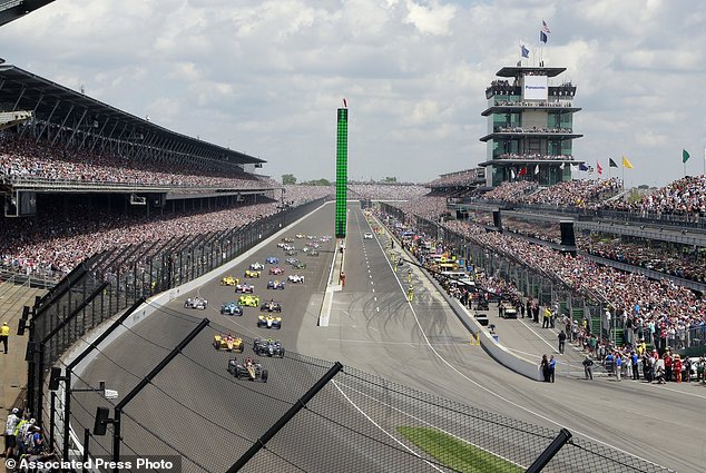 James Hinchcliffe of Canada leads the field into the first turn at the start of the 100th running of the Indianapolis 500 auto race at Indianapolis Motor Speedway in Indianapolis. Indianapolis 500 organizers spen