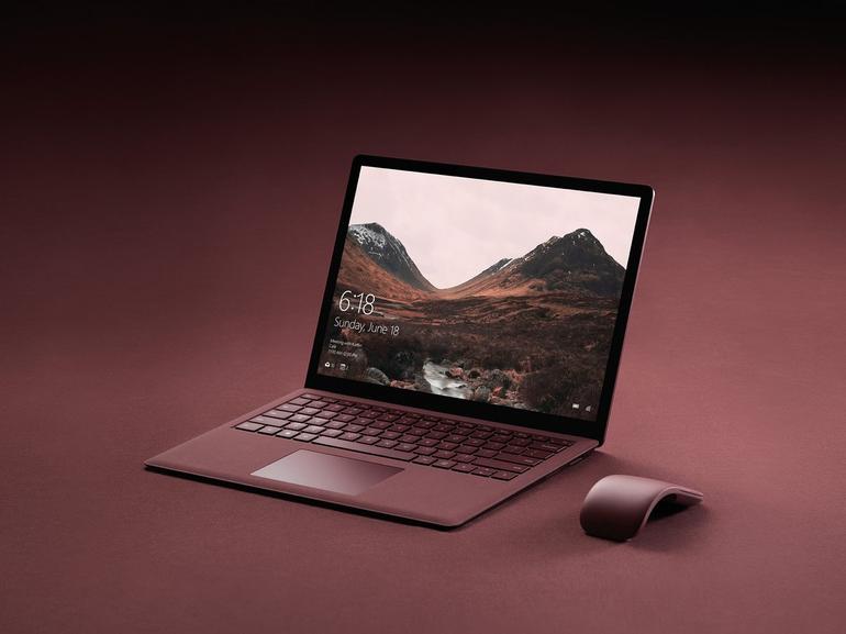 Microsoft's new Surface Laptop is available in Burgundy seen here alongside the new Surface Arc Mouse.               Image Microsoft