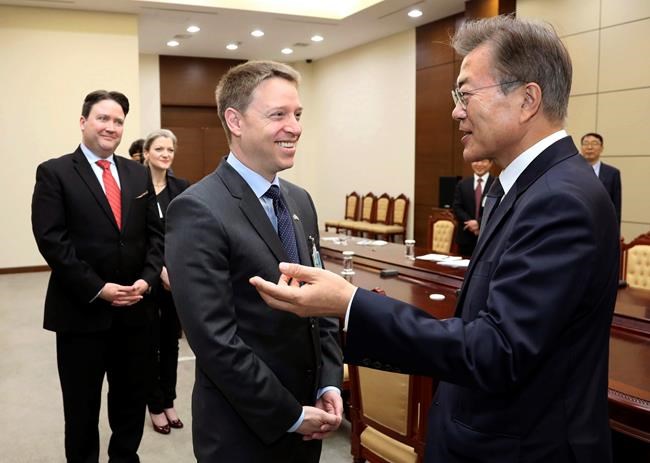 South Korean President Moon Jae-in right talks with Matt Pottinger Special Assistant to U.S. President Donald Trump and National Security Council Senior Director for East Asia during a meeting at the presidential Blue House in Seoul South Korea