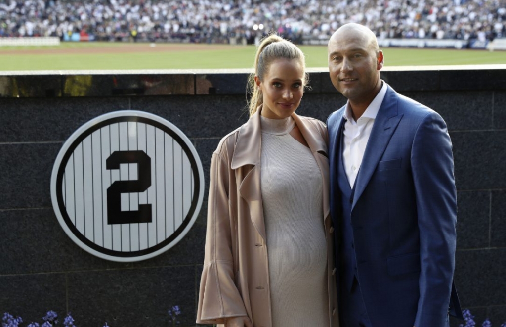 Retired New York Yankees shortstop Derek Jeter poses with his wife Hannah during a pregame ceremony on Sunday at Yankee Stadium