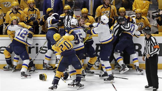 Nashville Predators and St. Louis Blues players fight during the third period in Game 4 of a second-round NHL hockey playoff series Tuesday