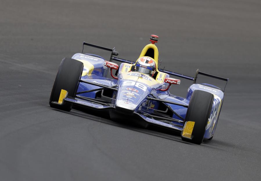 Alexander Rossi drives through the first turn during the running of the Indianapolis 500 auto race at Indianapolis Motor Speedway Sunday