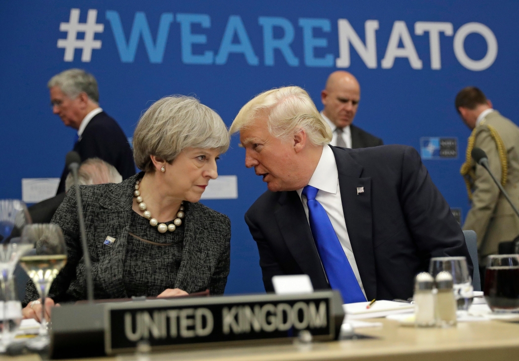 Theresa May and Donald Trump at the Nato summit in Brussels yesterday. Mr Trump said the leaks were “deeply troubling”AP