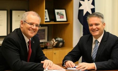 Treasurer Scott Morrison and Finance Minister Mathias Cormann with the Budget books in his office in Parliament House in Canberra