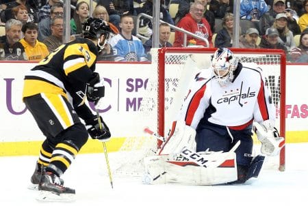 Washington Capitals goalie Braden Holtby makes a save against Pittsburgh Penguins center Nick Bonino