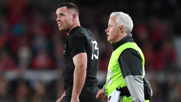 An injured Ryan Crotty.
leaves the field for the All Blacks