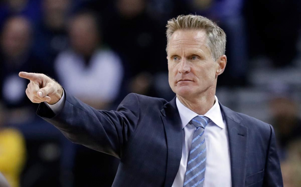 Golden State Warriors head coach Steve Kerr directs his team during the first half of an NBA basketball game against the Atlanta Hawks in Oakland California