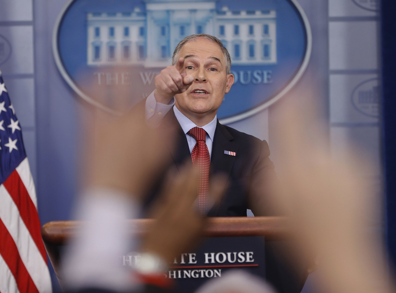 EPA Administrator Scott Pruitt points as he answers questions from members of the media during the daily briefing in the Brady Press Briefing Room of the White House in Washington Friday