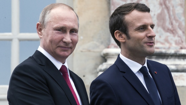 French President Emmanuel Macron right welcomed Russia's Vladimir Putin at the Palace of Versailles today. Past suspicions of Russian meddling in the French election resurfaced with Macron denouncing Russian media and Putin denying hacking allegat