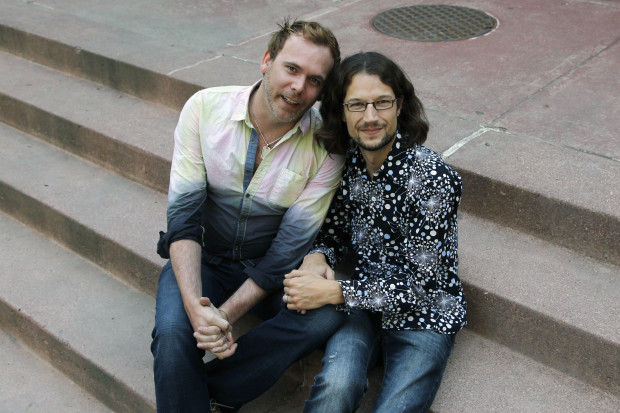 Dave Mullins sits with his husband Charlie Craig in Denver. The owner of a cake shop refused to make a wedding cake for the couple citing his religious beliefs and the couple then filed with the state's civil rights commission