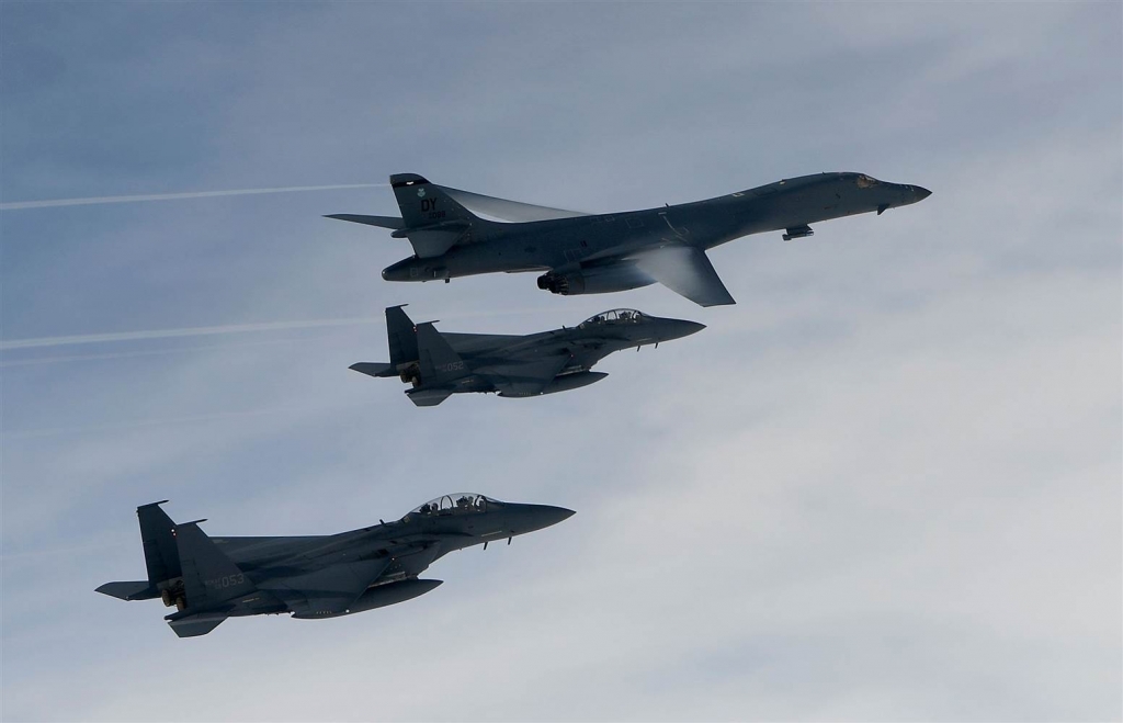 A U.S. Air Force B-1B Lancer bomber flies with South Korean jets during a joint live fire drill Friday