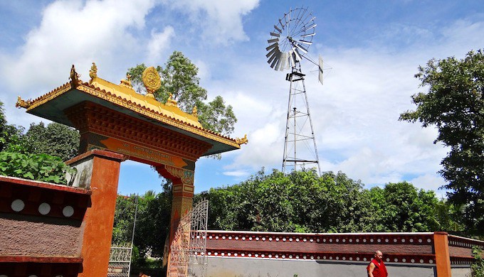 A windmill towers over a Tibetan settlement in the Indian Himalayas