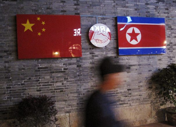 Chinese and North Korean flags outside the closed Ryugyong Korean Restaurant in Ningbo Zhejiang province China