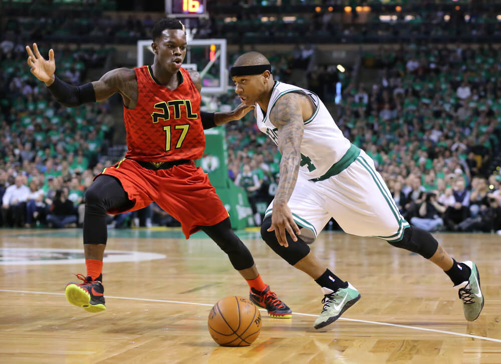 Boston MA USA- Atlanta Hawks&#039 Dennis Schroder guards against Boston Celtics&#039 Isaiah Thomas during the first half on Sunday