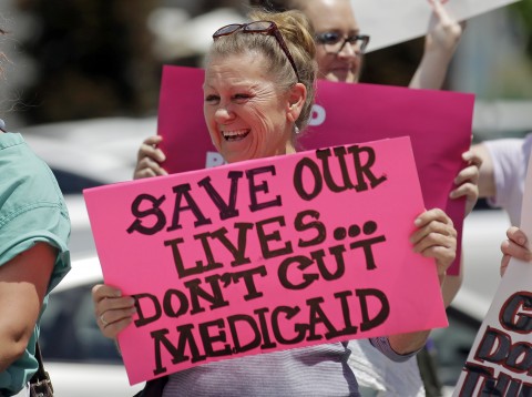 Demonstrators protest the Republican bill in the Senate to replace the Affordable Care Act