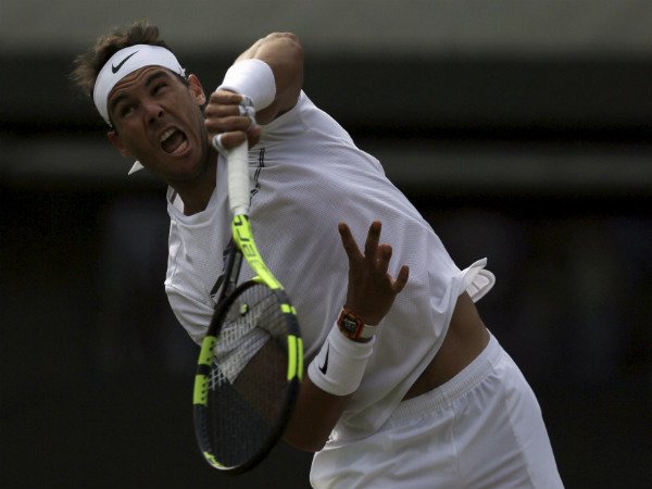 Spain's Rafael Nadal serves to Luxembourg's Gilles Muller during their Men's Singles Match on day seven at the Wimbledon