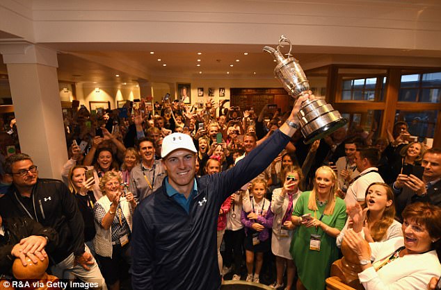 Spieth lifts the Claret Jug into the air after emerging as the victor at The Open on Sunday