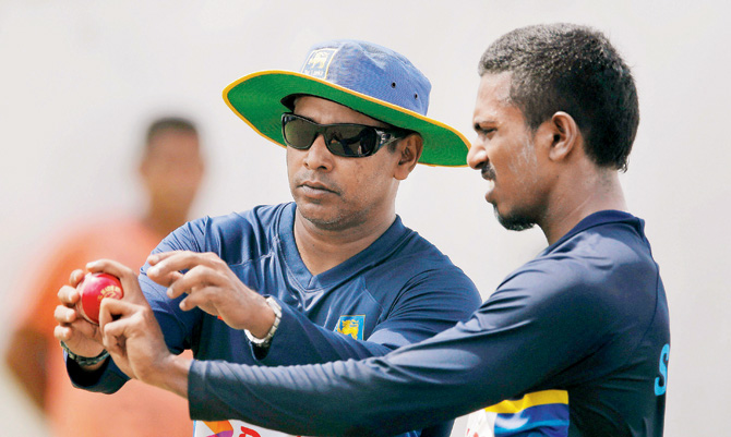 Sri Lanka's fast bowling coach Chaminda Vaas instructs Vishwa Fernando during a training session in Galle yesterday. Pic  AP PTI