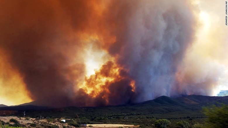 Dozens of large active fires burning in West