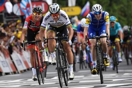 Slovakia's Peter Sagan sprints to win ahead of Belgium's Greg Van Avermaet and Ireland's Daniel Martin at the end of the 212,5 km third stage of the 104th edition of the Tour de France cycling race