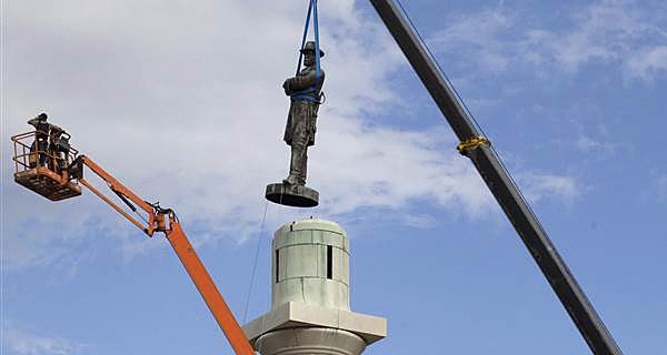 A statue of Confederate General Robert E. Lee is removed from Lee Circle Friday