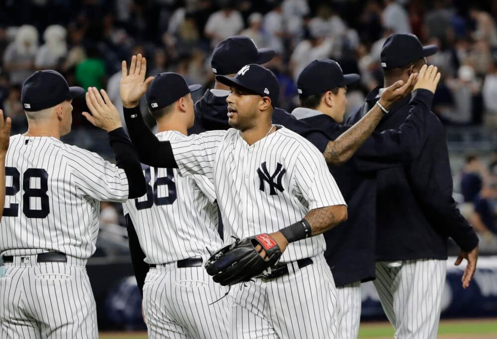 New York Yankees&#039 Aaron Hicks celebrates with teammates after a baseball game against the Baltimore Orioles Friday