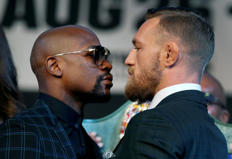 Floyd Mayweather Jr. of the U.S. and UFC lightweight champion Conor Mc Gregor of Ireland face off during a news