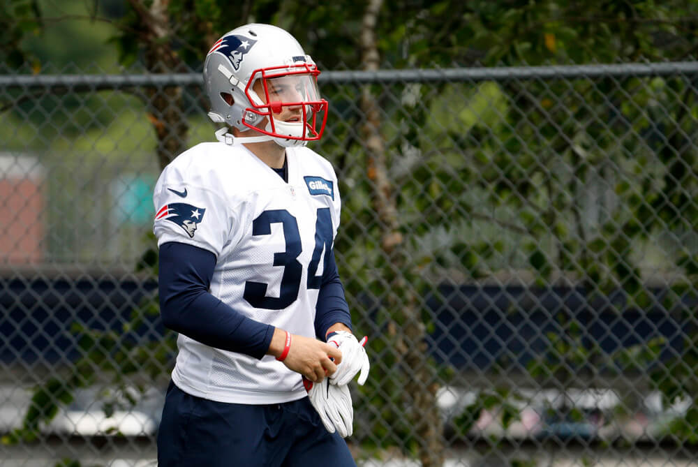 FOXBOROUGH MA- JULY 27 New England Patriots running back Rex Burkhead walks onto the field during New England Patriots training camp