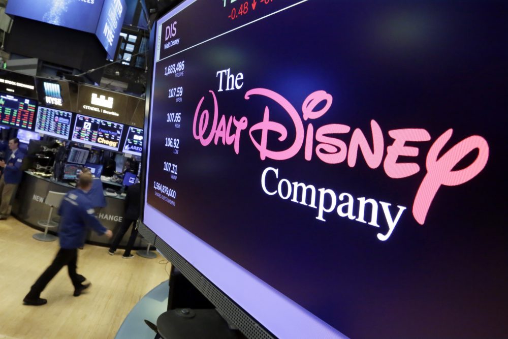 The Walt Disney Co. logo appears on a screen above the floor of the New York Stock Exchange