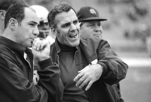 Navy head coach Rick Forzano left and Notre Dame head coach Ara Parseghian talk on the sideline during a football game in Philadelphia. Notre Dame defeated Navy 56-7. Parseghian died Wednesda