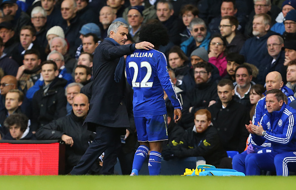 LONDON ENGLAND- NOVEMBER 29 Jose Mourinho Manager of Chelsea hugs Willian of Chelsea as he comes off during the Barclays Premier League match between Tottenham Hotspur and Chelsea at White Hart Lane