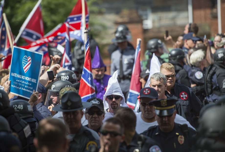 Members of the Ku Klux Klan arrive for a rally calling for the protection of Southern Confederate monuments in Charlottesville Virginia