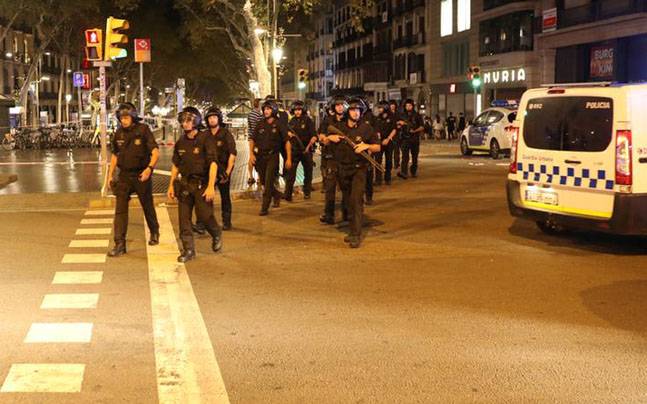 Spain hunts driver who killed 13 in Barcelona, says bomb plot foiled