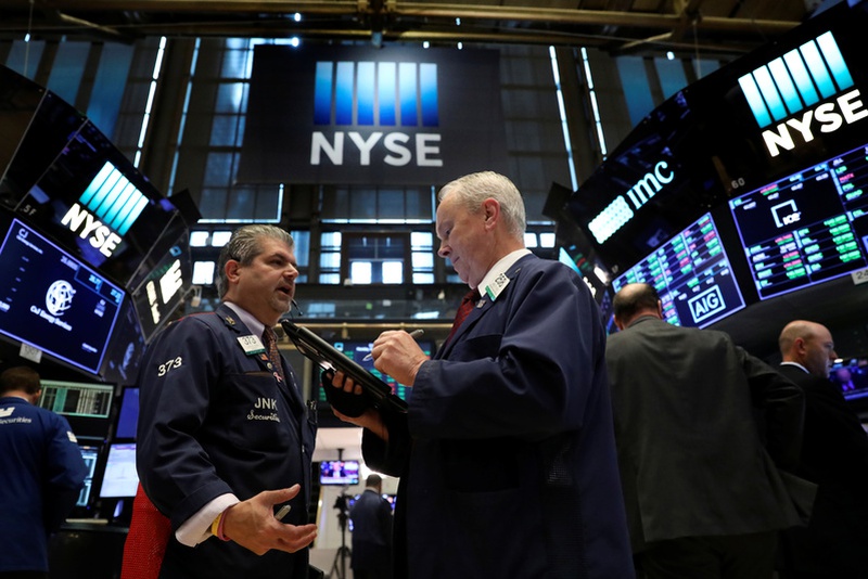 Traders work on the floor of the New York Stock Exchange in New York U.S