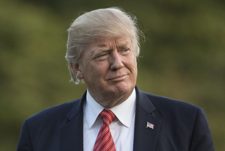 President Donald Trump walks from Marine One across the South Lawn of the White House on Wednesday Aug. 23 2017 as he returns from Reno Nev