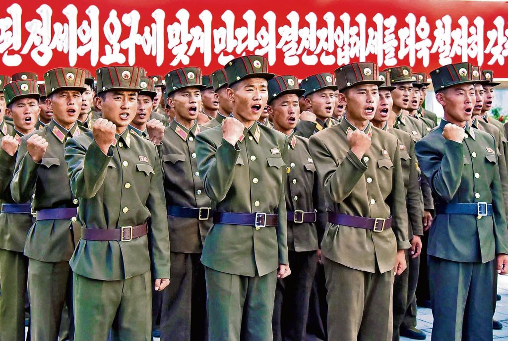 Troops of the Ministry of People’s Security show their support for North Korea’s stance against the US in Pyongyang. A state newspaper warned that the US could be reduced “to ashes any moment”