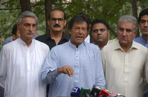 Pakistani opposition leader Imran Khan speaks to reporters in Islamabad Pakistan Wednesday Aug. 23 2017. Khan called for the government to convene a special session of the Parliament to hold a debate on US President Donald