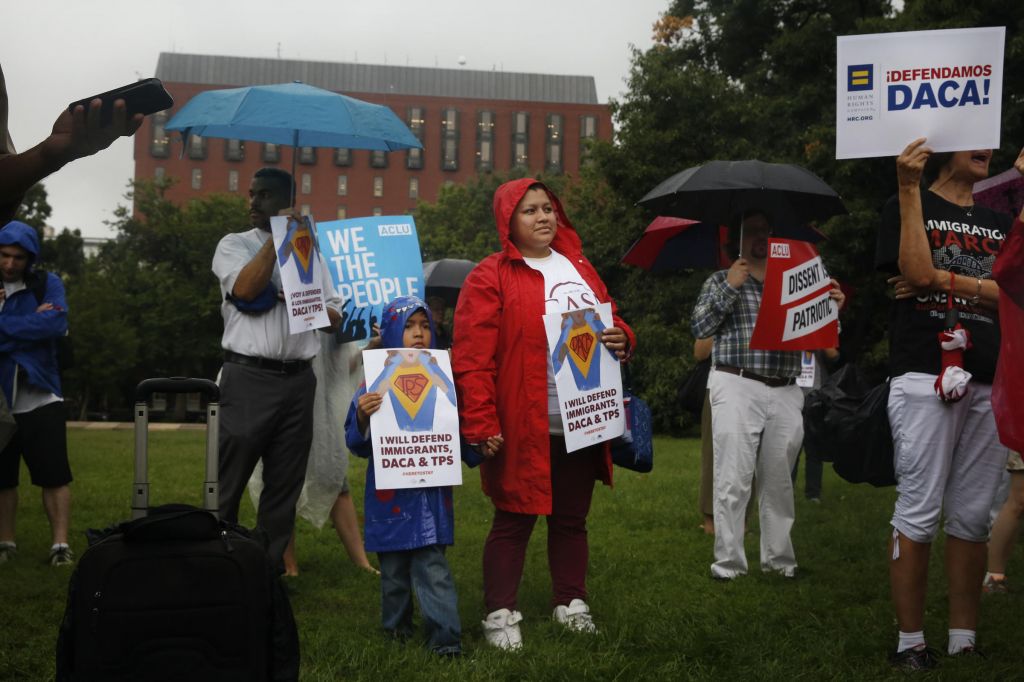 Protesters hold signs and chant at a rally for DACA in Washington D.C