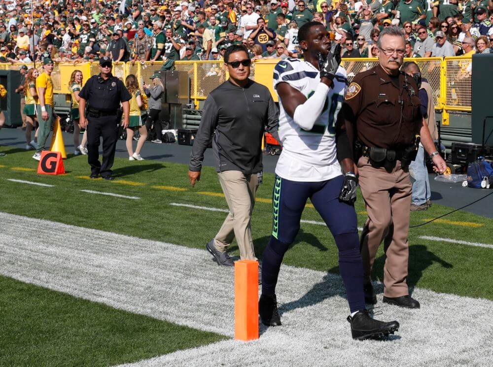 Seattle Seahawks&#039 Jeremy Lane walks off the field after being ejected from the game during the first half of an NFL football game Sunday Sept. 10 2017 in Green Bay Wis