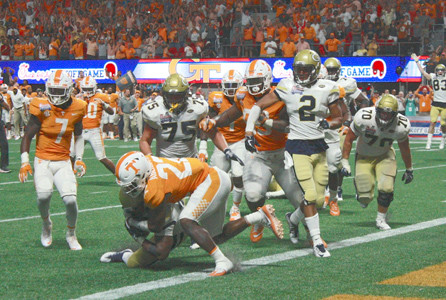 GEORGIA TECH is stopped on the last play of the game in a 42-41 double-overtime loss to Tennessee in the Chick-fil-A Kickoff Game at Mercedes Benz Stadium in Atlanta Monday night. The Yellow Jackets lost despite rushing for over 500 yards