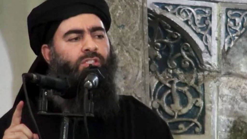 Abu Bakr al Baghdadi delivering a sermon at Mosul's al Nuri mosque in Iraq during his supposed first public appearance