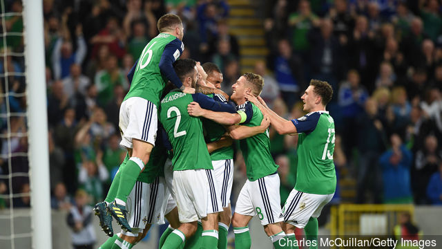 Jonny Evans of Northern Ireland celebrates with team mates after scoring during the FIFA 2018 World Cup Qualifier between Northern Ireland and Czech Republic at Windsor Park on September 4